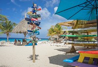 Beach colorful directions stand. Free public domain CC0 image.