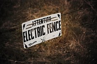 Electric fence sign. Free public domain CC0 photo.