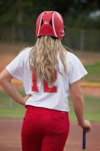 Female baseball player. Free public domain CC0 photo.