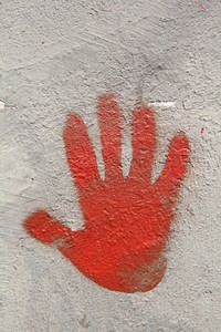 Red hand painted on concrete texture. Free public domain CC0 photo.