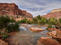 A purple raft is the only unnatural element near a travertine pool above Fifty-Foot Falls, one of five Havasupai Falls deep in Arizona&rsquo;s Havasu Canyon, an offshoot of Grand Canyon National Park but on lands administered by the Havasupai Indian Tribe.