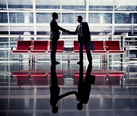 Business handshake in an airport