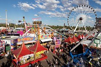 Carnival rides and games, including a Ferris wheel, in Phoenix at the annual Arizona State Fair, which has been held since 1884, eighteen years before statehood, when it was a territorial fair.