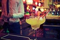 Free yellow cocktail, bar background photo, public domain beverage CC0 image.