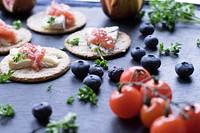 Free cheese on top of biscuits with blackberry and tomato image, public domain food CC0 photo.