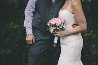 Free bride holding flower bouquet image, public domain CC0 photo.