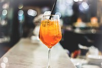 Free orange cocktail dink on bar top photo, public domain beverage CC0 image.