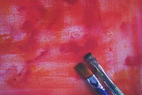 Paint brushes on canvas background, free public domain CC0 image.