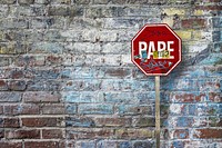 Free pare Spanish stop sign in front of brick wall image, public domain CC0 photo.