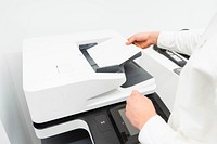 Free close up of person hands using photocopier machine in office image, public domain CC0 photo.