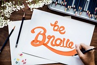 An artist creating hand lettering artwork