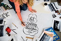 A female artist working on hand lettering project