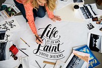 A female artist working on hand lettering project