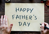 Phrase Happy Father&#39;s Day on a yellow paper