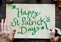 Phrase Happy Saint Patrick&#39;s Day on a yellow paper