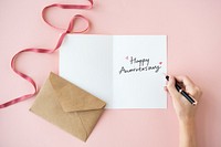 Woman writing a Happy Valentine&#39;s Day card
