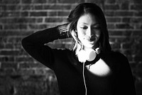 Beautiful Asian woman with headphones