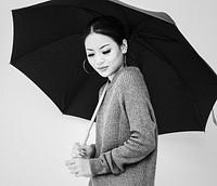 Asian woman holing umbrella on white background