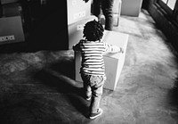 African kid playing with a box