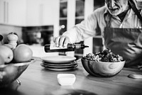 Senior man cooking in the kitchen