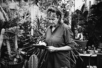 Woman gardening in her greenhouse