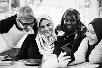 Group of Muslim students using mobile phones