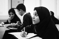 Diverse muslim children studying in a classroom