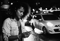 Woman using a mobile in the streets