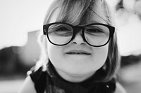 Cheerful pretty little girl with glasses