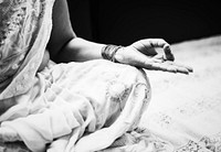 An Indian woman meditating alone