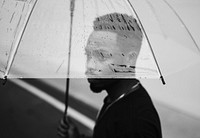 African man using an umbrella