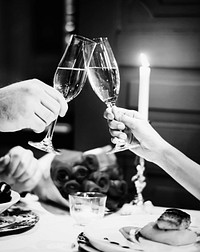 Couple making a toast at a romantic dinner