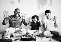 African family painting the room wall