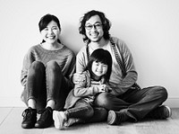 Asian family sitting on the floor