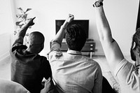 Friends watching sports in the living room