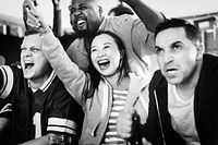 Friends watching sports at a bar