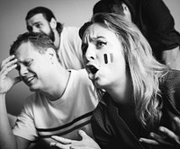 Friends watching sports in the living room