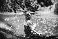 Beautiful woman at a waterfall