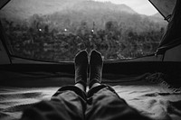 Woman sleeping in a tent with mountain view