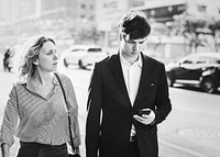 Couple walking in downtown together