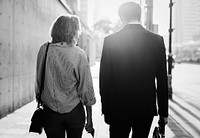 Couple walking on the pavement