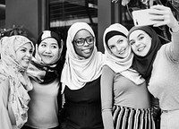 Muslim friends taking selfie together