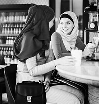 Muslim women relaxing in a coffee shop