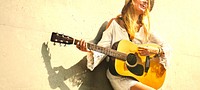 Beautiful singer songwriter with her guitar