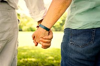 Senior couple holding hands at the park