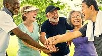 Active senior friends exercising at the park