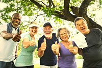 Active senior friends exercising at the park