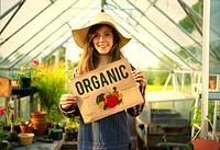 Woman growing organically in a greenhouse
