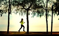 Woman jogging by the beach