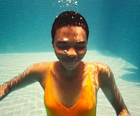Girl swimming under the water